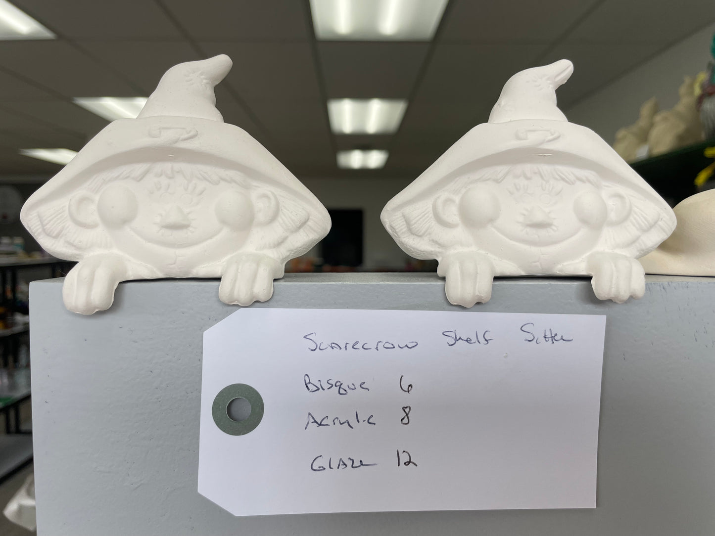 Scarecrow shelf sitter